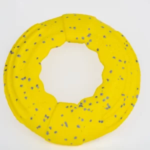 This durable yellow ring dog toy features gray speckles and a textured surface for easy grip. Its circular design makes it perfect for chewing, fetch games, and interactive playtime with your dog.