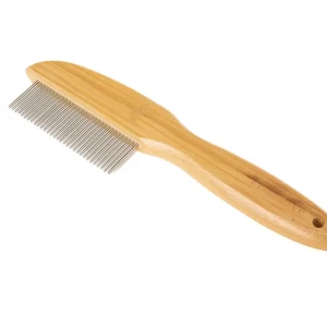 This image showcases the elegant yet practical design of our dog grooming comb. The eco-friendly material bamboo handle offers a lightweight feel and comfortable grip, while the stainless steel teeth are perfectly aligned to handle shedding and detangling with ease, promoting a healthy coat.