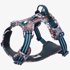 A complete view of the dark blue floral dog harness against a white background. It highlights the padded chest piece, adjustable straps, dual silver leash attachment points, and a secure side-release buckle for a comfortable and safe fit.